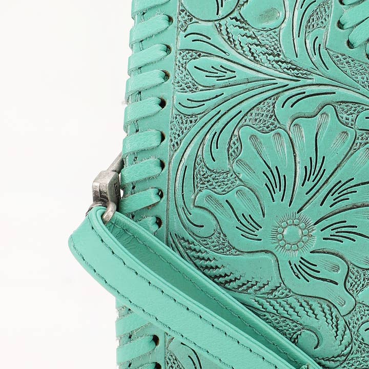 Hand-tooled turquoise leather and whipstitch detail on the Alma bag