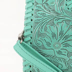 Hand-tooled turquoise leather and whipstitch detail on the Alma bag