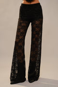 Front view of black floral lace flare pants with inner shorts