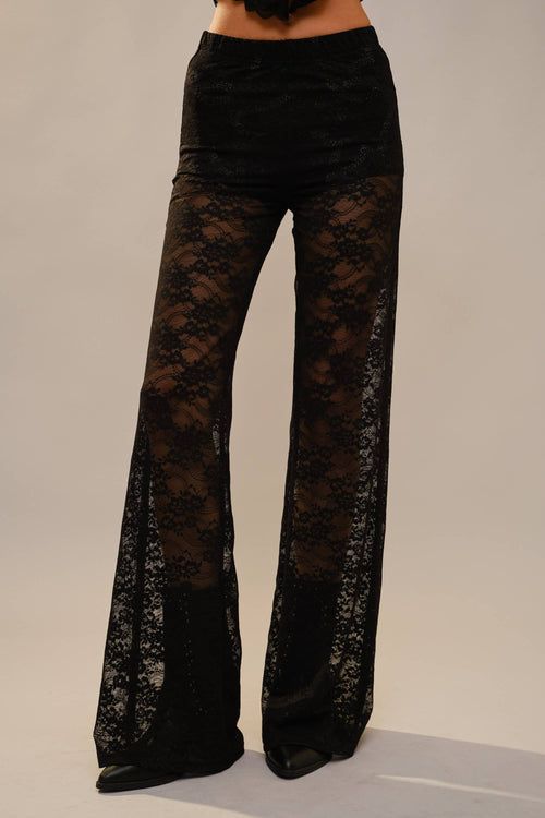 Front view of black floral lace flare pants with inner shorts