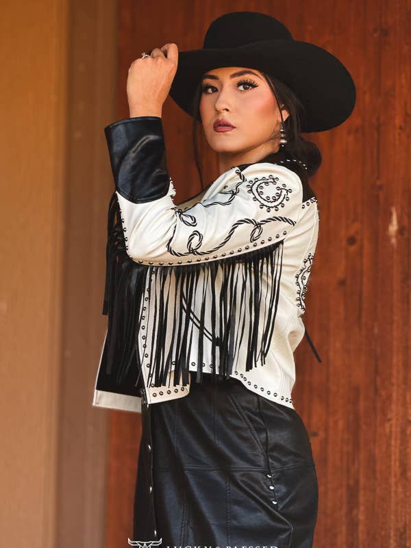 Model wearing the black and ivory embroidered fringe jacket