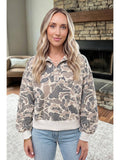Model wearing the camouflage collared pullover