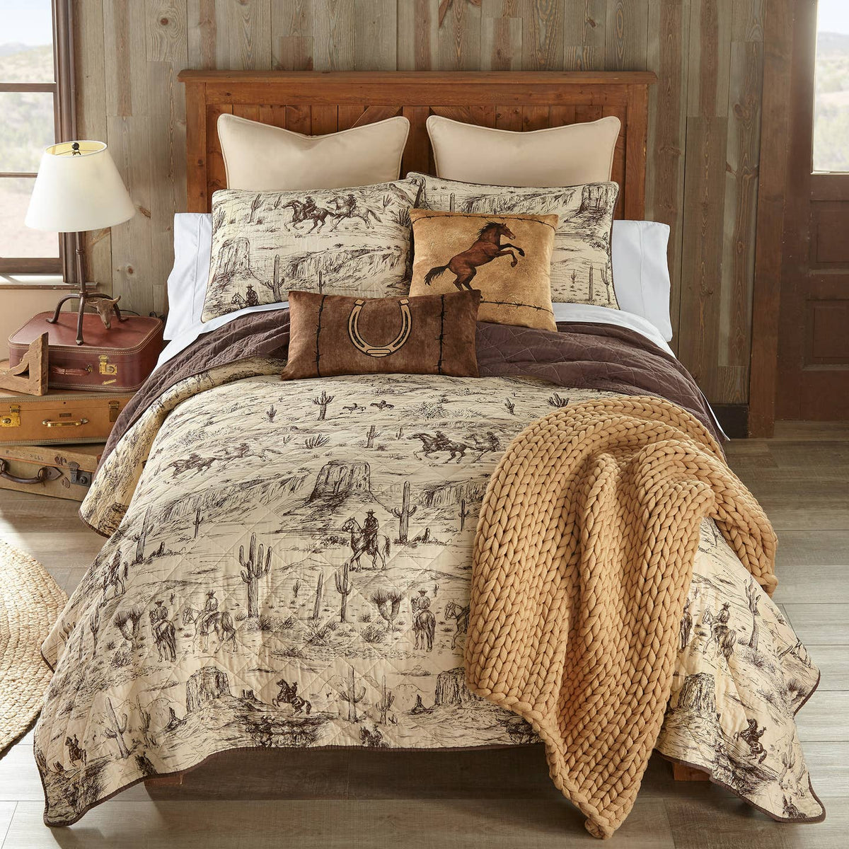 Donna Sharp Cowboy Cotton Quilt and matching shams styled on a bed; decorative pillows and other accessories not included