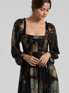 Black multi floral chiffon maxi dress with smocked bodice and sheer long sleeves