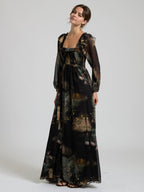 Black multi floral chiffon maxi dress with smocked bodice and sheer long sleeves