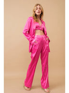 Hot pink three-piece satin blazer and trouser set, front and side view