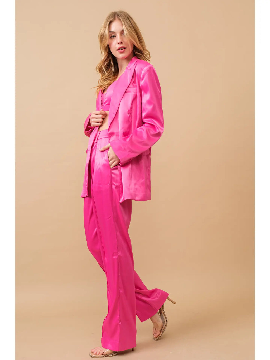 Hot pink three-piece satin blazer and trouser set, front and side view