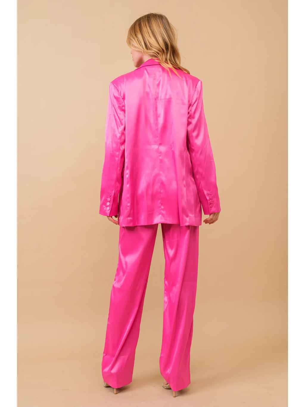 Hot pink three-piece satin blazer and trouser set, back view