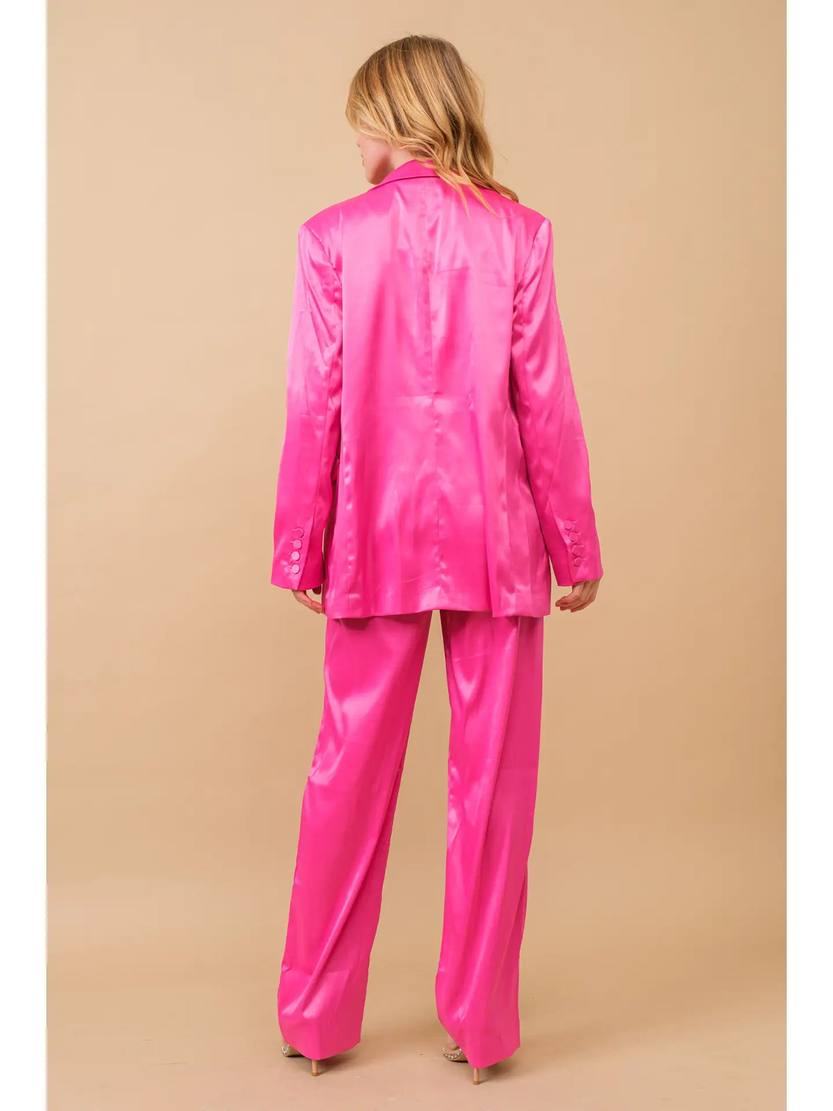 Hot pink three-piece satin blazer and trouser set, back view