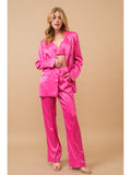 Hot pink three-piece satin set with bralette, blazer and trousers