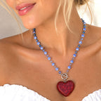 Red resin heart necklace with blue-and-white ceramic beads