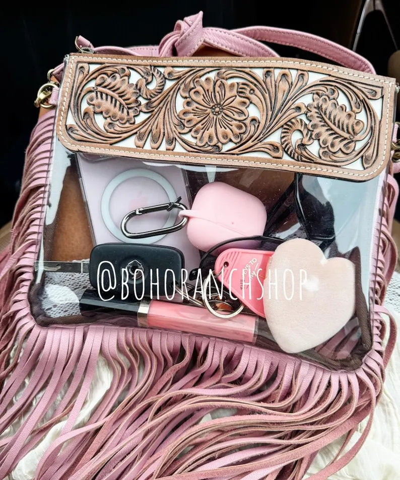 Pink hand-tooled clear crossbody with fringe; contents not included