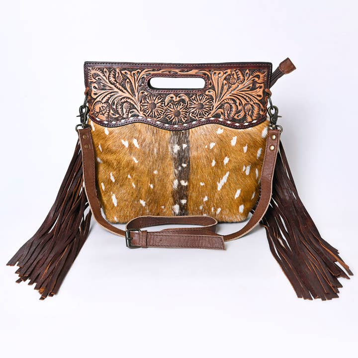 Hand-tooled hair-on leather crossbody bag detail