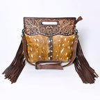 Hand-tooled hair-on leather crossbody bag detail