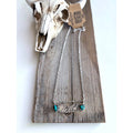 Wild pendant necklace with two turquoise-colored hearts