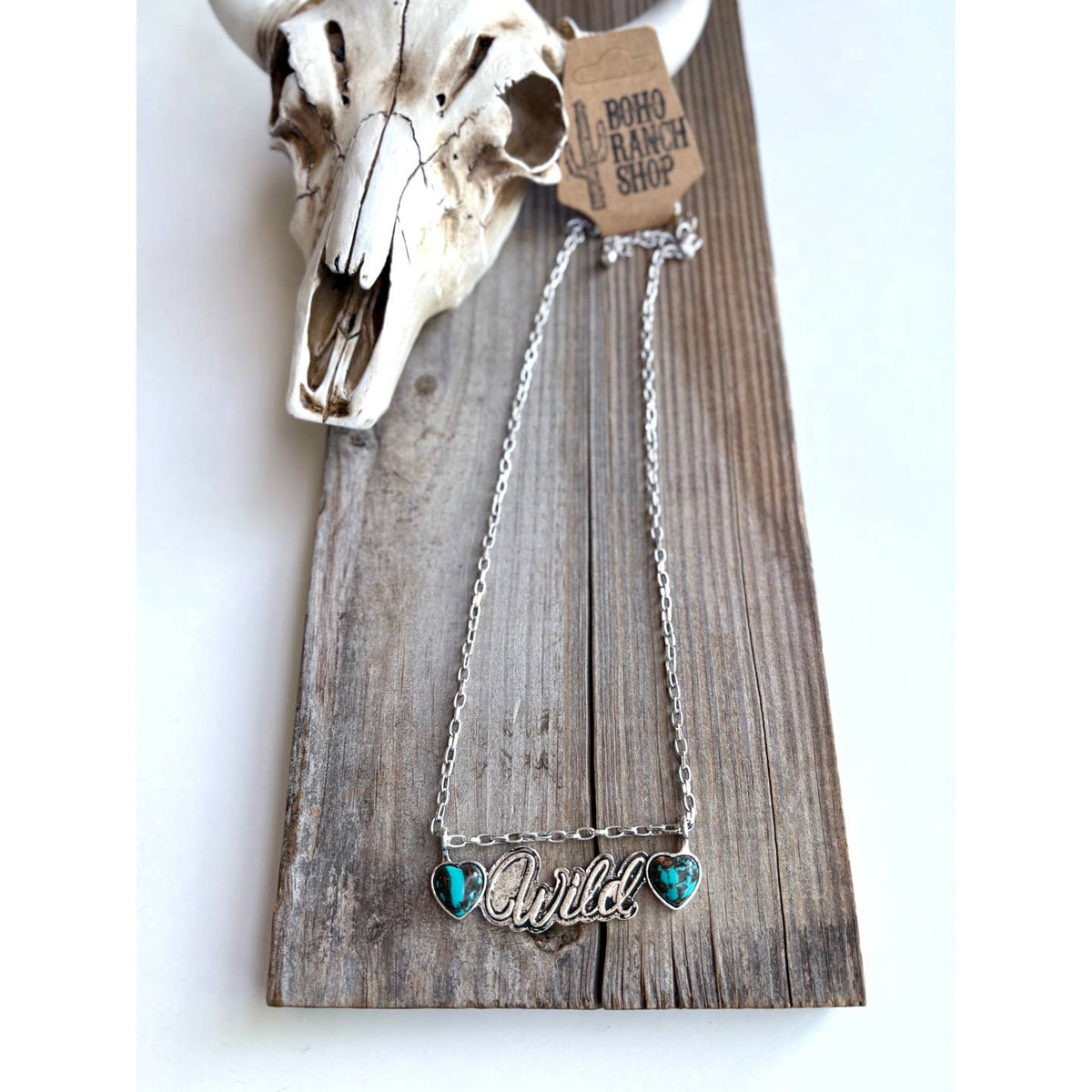 Wild pendant necklace with two turquoise-colored hearts