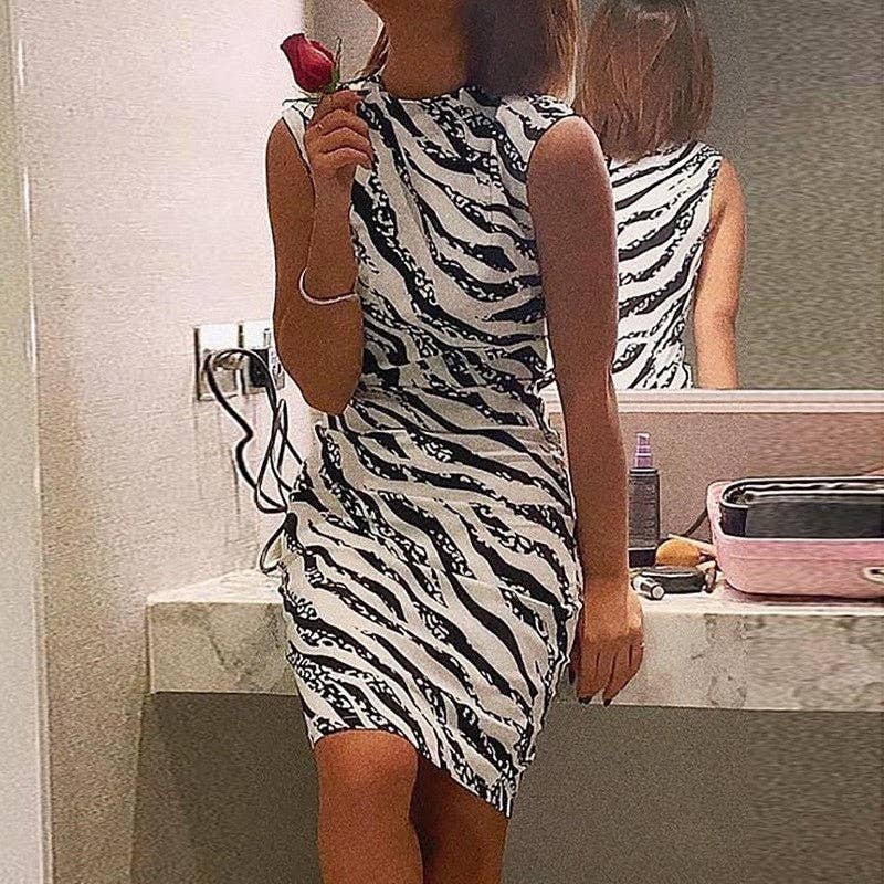 Supplier's model wearing the sleeveless white and black zebra bodycon dress