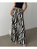 Black and cream zebra print wide-leg pants, styled front view